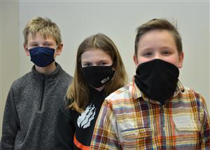 three students in masks 
